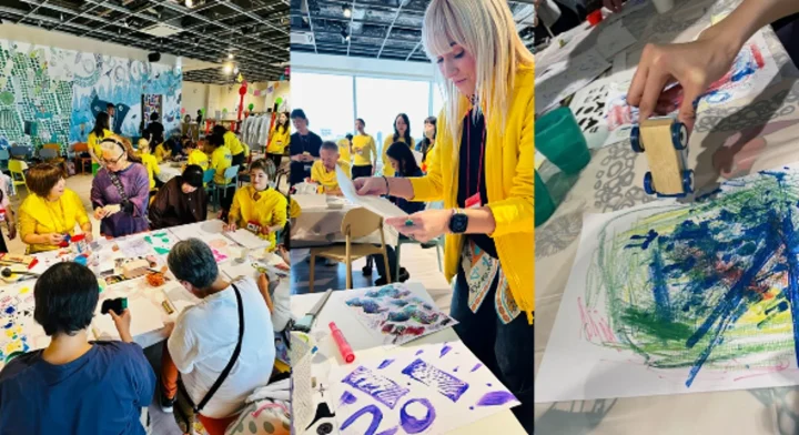 人々がアートワークショップで創作活動に没頭している様子