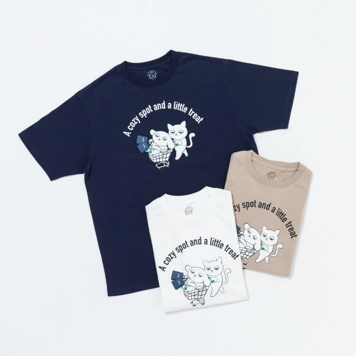 ショッピングカートを押す猫がデザインされたTシャツ