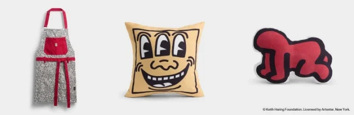 キース・ヘリングのアートワークをフィーチャーしたエプロン、クッション、ぬいぐるみ