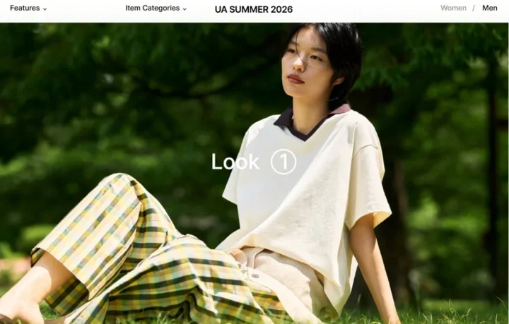 緑の芝生に座る若い女性