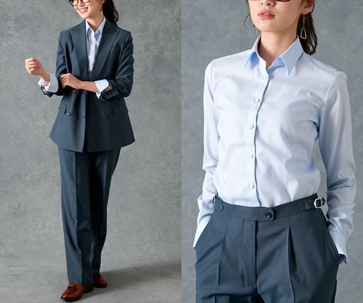 紺色のダブルブレストスーツと水色のシャツを着用した女性のビジネスファッションスタイル