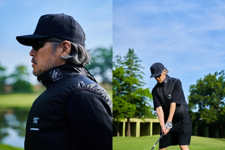 ゴルフコースでスイングの構えをする男性